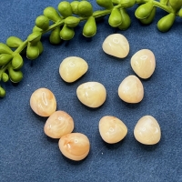 10 Acrylperlen unförmige Steinform cremefarbig