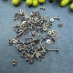 50 Ohrstecker und Flügel im Set altsilber
